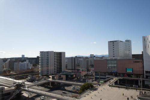 a view of a city with tall buildings at Hotel Terrace the Garden Mito in Mito
