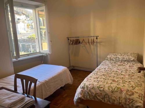 Postel nebo postele na pokoji v ubytování Sunny apartment in Lugano