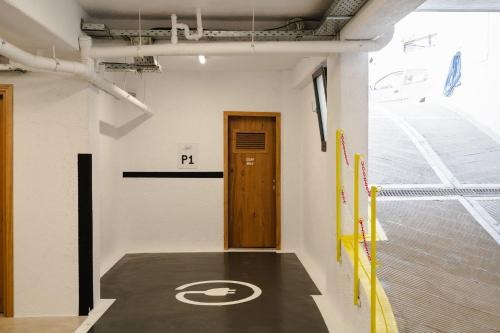a room with a parking sign on the floor and a door at Legato Spa Suites With Private Pool in Naxos Chora