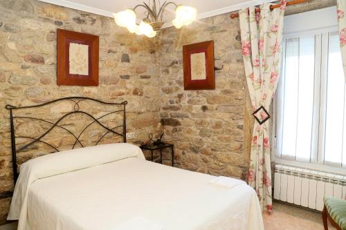 Un pat sau paturi într-o cameră la Casa Nunes