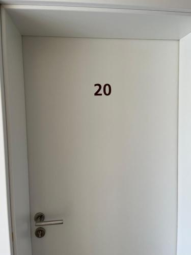 an elevator door with the number on it at Hotel Herzog in Hamm