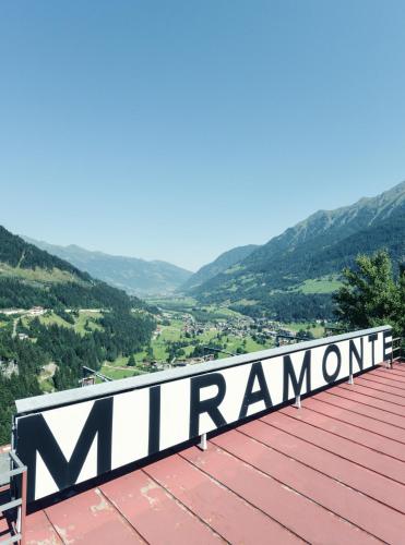 a sign on the roof of a mountain at Design Hotel Miramonte in Bad Gastein