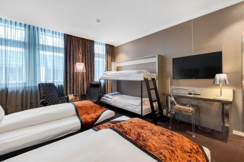 Postel nebo postele na pokoji v ubytování Clarion Hotel Ernst