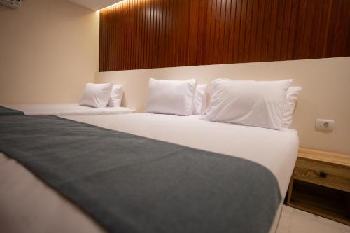 Cama o camas de una habitación en New Pyramid Front Hotel