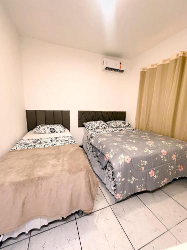 Katil atau katil-katil dalam bilik di Casa em Maceió Praia Pontal da Barra