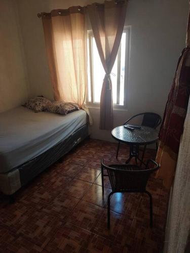 Llit o llits en una habitació de Hospedaje Amatitlan