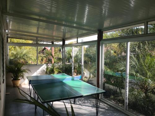 a glass table in a room with windows at Apartamentos PREMIUM CON YACUZZI DUNAS DEL ESTE in Punta Colorada