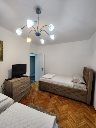 Postel nebo postele na pokoji v ubytování Bozovic Apartments I