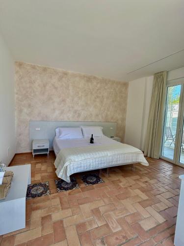 a bedroom with a large bed in a room at La Depèndance Luxury Rooms in Francavilla al Mare
