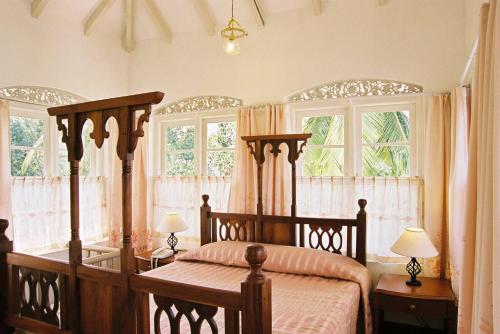 Postel nebo postele na pokoji v ubytování Manor House-Kandy