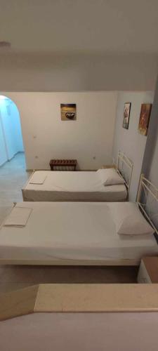 Ένα ή περισσότερα κρεβάτια σε δωμάτιο στο Villa Avra