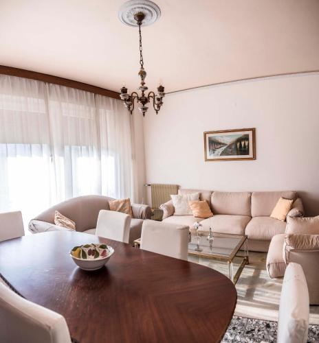 a living room with a table and a couch at Casa Vacanze - SportHoliday House Segusino-Valdobbiadene in Segusino