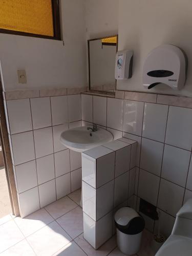 a bathroom with a sink and a mirror at Casa Rosita Sausa in Jauja