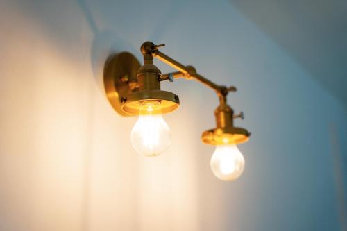 a couple of lights hanging on a wall at The Brambles Retreat in the Mournes in Annalong