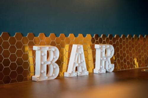 a table with the letters beta in front of a wall at The Brambles Retreat in the Mournes in Annalong