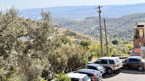 a group of cars parked in a parking lot at Kruja Retreat in Krujë