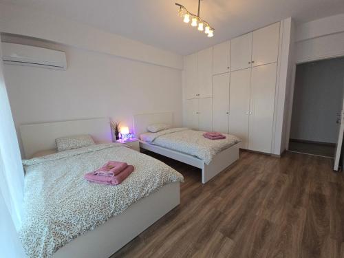 Postel nebo postele na pokoji v ubytování Sunny Rooms