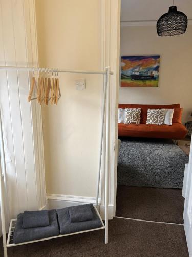 a living room with a couch in the corner at Heart of Oban in Oban