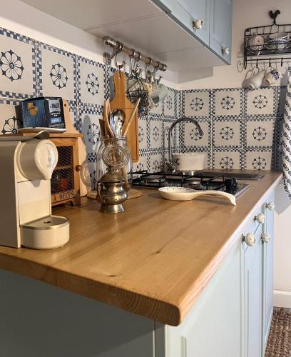 a kitchen with a wooden counter top in a kitchen at La casetta di Vale in Marano Equo