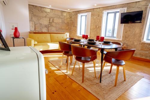 a dining room with a table and chairs at Authentic Porto Village in Porto
