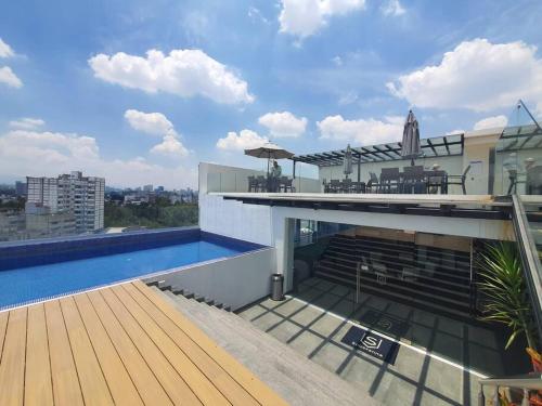 Πισίνα στο ή κοντά στο Mili & Mila Depto con Alberca y Gym en el corazón de Condesa y Roma