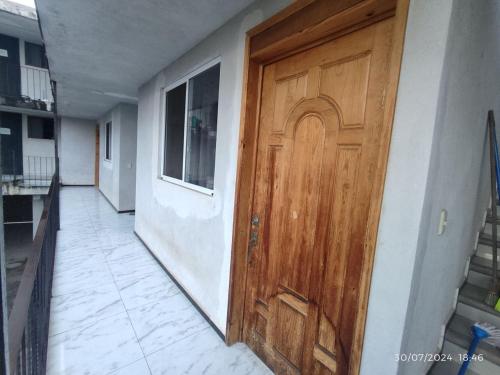 a wooden door on the side of a building at Hotel Mextlitlán Tierra de Lunas in Zacatlán
