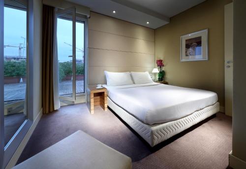 Tempat tidur dalam kamar di Hotel Saint John