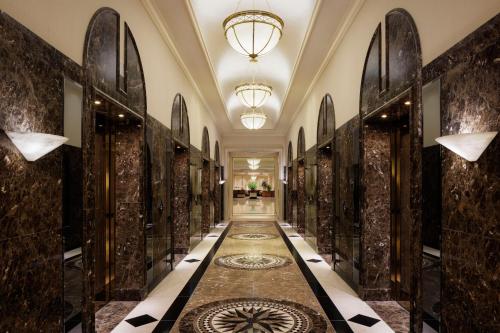 a hallway of a building with a tile floor and a hallwayngthngthngthngth at Nagoya Marriott Associa Hotel in Nagoya