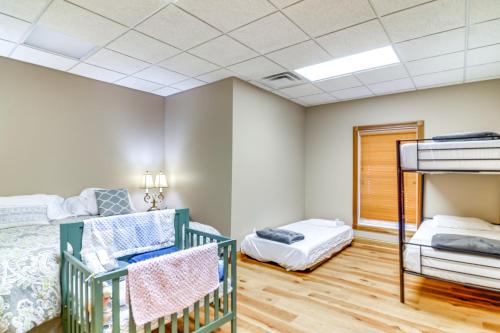 a bedroom with a bunk bed and a crib at Lake Cumberland Retreat with Deck and Views! in Jamestown