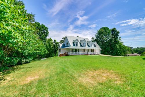 a large house on a large grassy field at Lake Cumberland Retreat with Deck and Views! in Jamestown