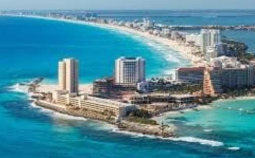 an aerial view of a city on the beach at Arena room in Cancún