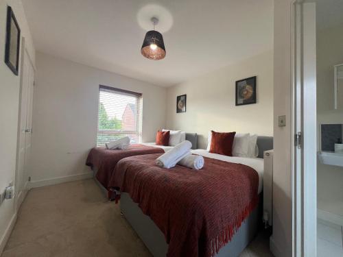 a bedroom with two beds and a window at Great Ambience 3-Bedroom for Groups & Contractors in Rubery