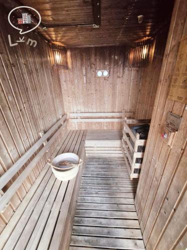 an empty wooden sauna with a toilet in it at The Central Pattaya High Floor, Pattaya City in Pattaya Central