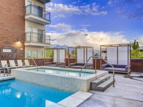 a swimming pool on the side of a building at Penthouse Apt - PoolGymHotTubPkg - View! in Salt Lake City