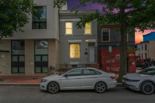 a white car parked in front of a house at Close To Howard University , Unit #2 in Washington, D.C.