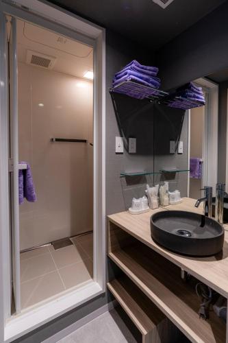 a bathroom with a sink and a shower at Niseko Grand Hotel in Niseko