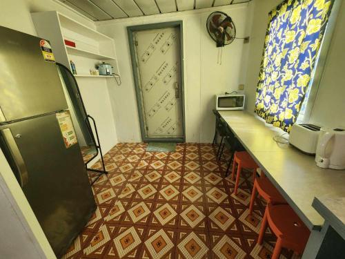 a kitchen with a counter and a door in a room at GoodWorks Accommodation in Yangor