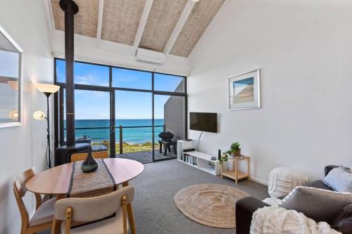 a living room with a view of the ocean at 12 Whitecrest Great Ocean Road Resort - Ocean Views in Wongarra