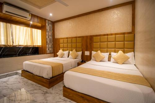 Postel nebo postele na pokoji v ubytování Hotel BKC Prime Near Trade Centre US Embassy, Mumbai