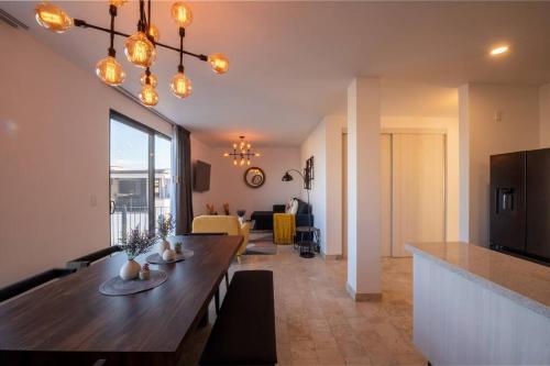 a living room with a dining table and a living room at Departamento San Miguel- La Luminaria-Confort in San Miguel de Allende