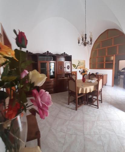 a kitchen and dining room with a table and chairs at Casa Galatea in Galatone
