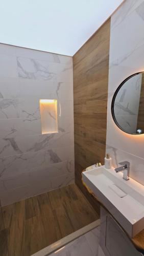 a bathroom with a sink and a mirror at Urban Retreat - Sliven City Center in Sliven