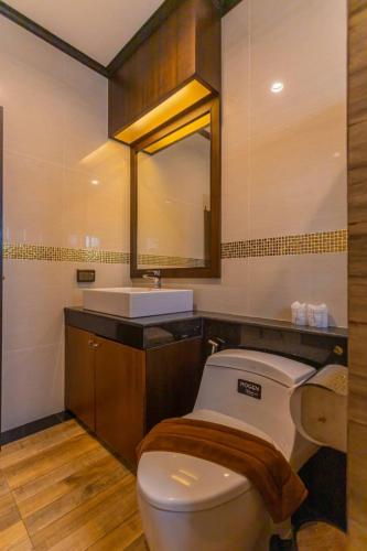 a bathroom with a toilet and a sink at Monica Villa 24 in Ao Nang Beach