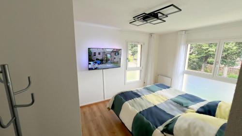 Ένα ή περισσότερα κρεβάτια σε δωμάτιο στο Room with double size bed in Kaysersberg center