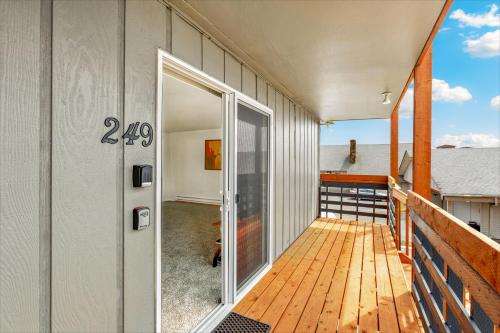 a balcony with a door on the side of a building at High Dunes Condos in Ocean Shores