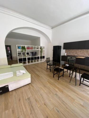 a living room with a couch and a table at Loft Eleonora D’Arborea in Quartu SantʼElena