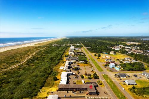 an aerial view of a beach and the ocean at High Dunes Condos in Ocean Shores