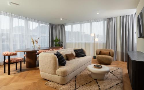 a living room with a couch and a table at master Mirabell in Salzburg