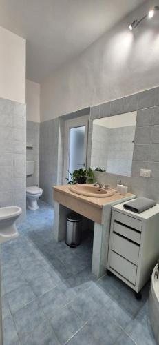a bathroom with a sink and a toilet and a mirror at Pisa Tower view in Pisa
