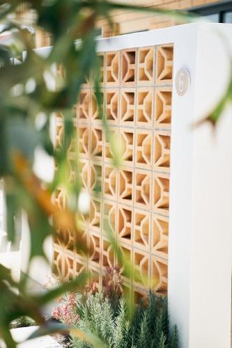 a door with a lattice pattern on it at The Mysa Motel in Gold Coast